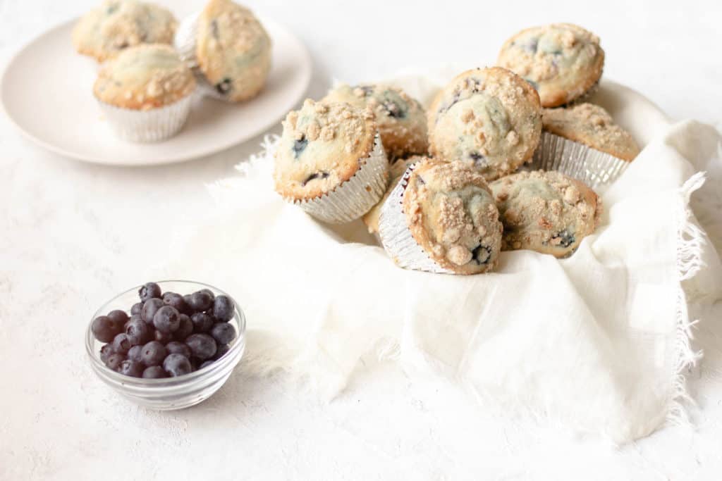 blueberry cherry muffins piled together in a bowl