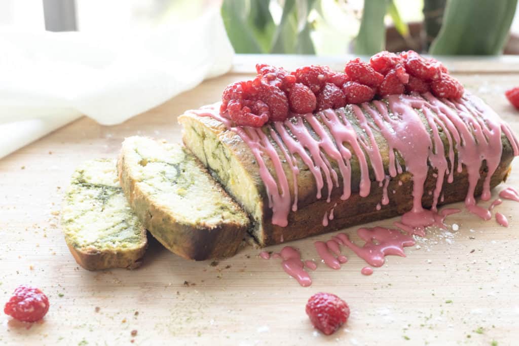 matcha lemon marble pound cake sliced on a cutting board