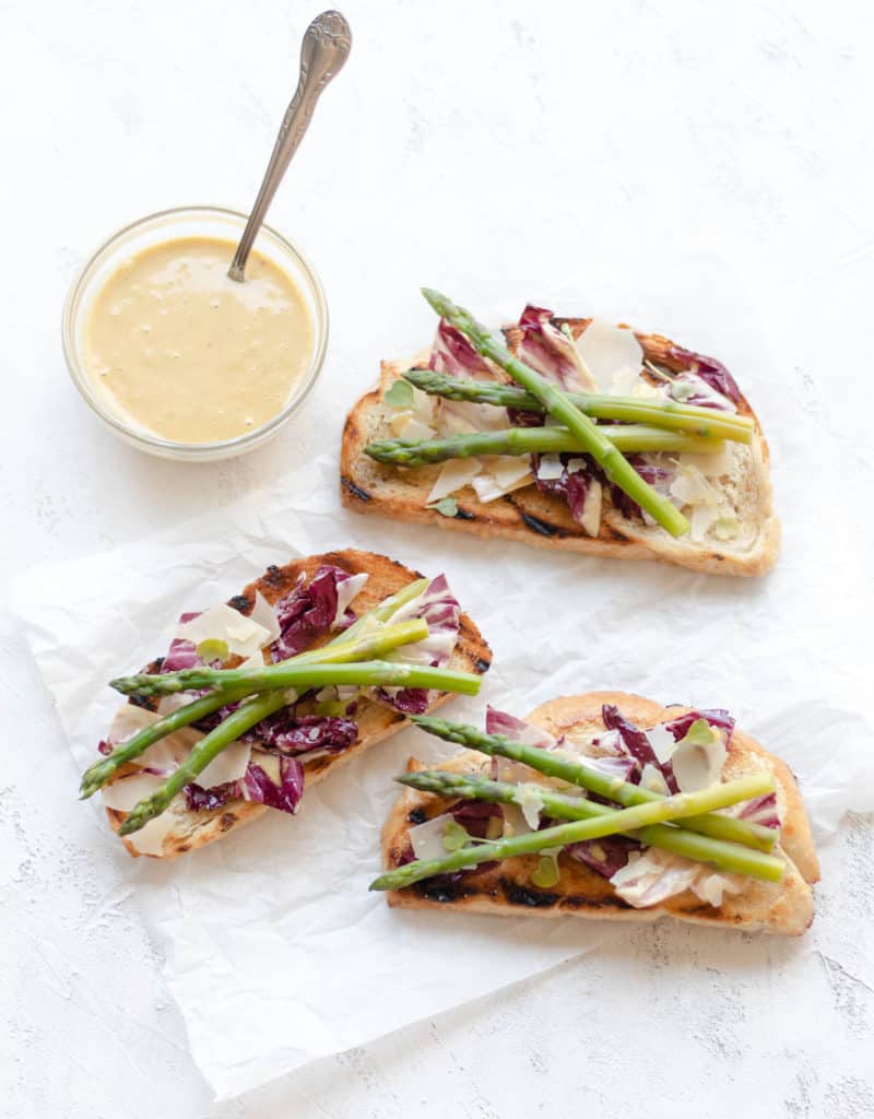 radicchio caesar toast with a side of caesar dressing