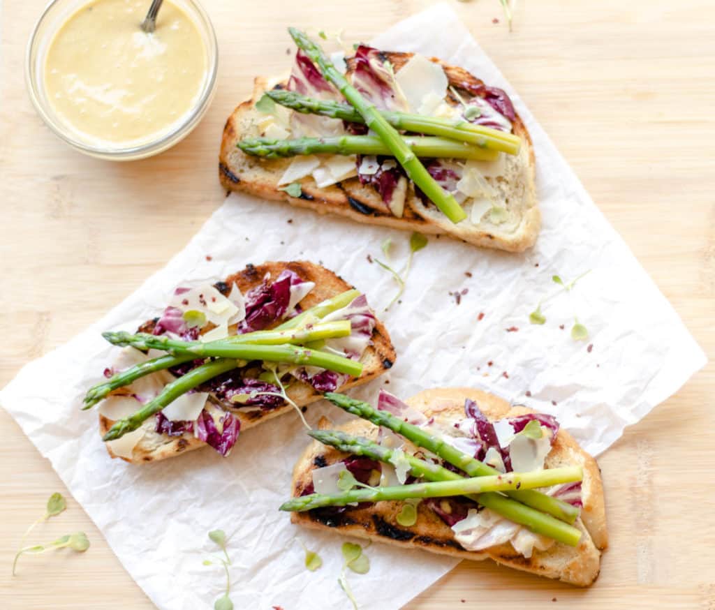 asparagus radicchio caesar toast on parchment paper