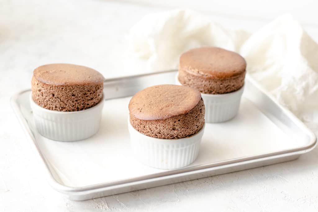 chocolate soufflé fresh out the oven on a baking tray