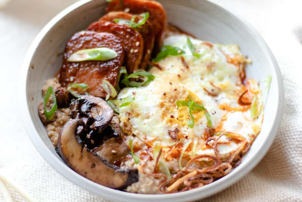 savory oats with spam, over easy egg and mushrooms