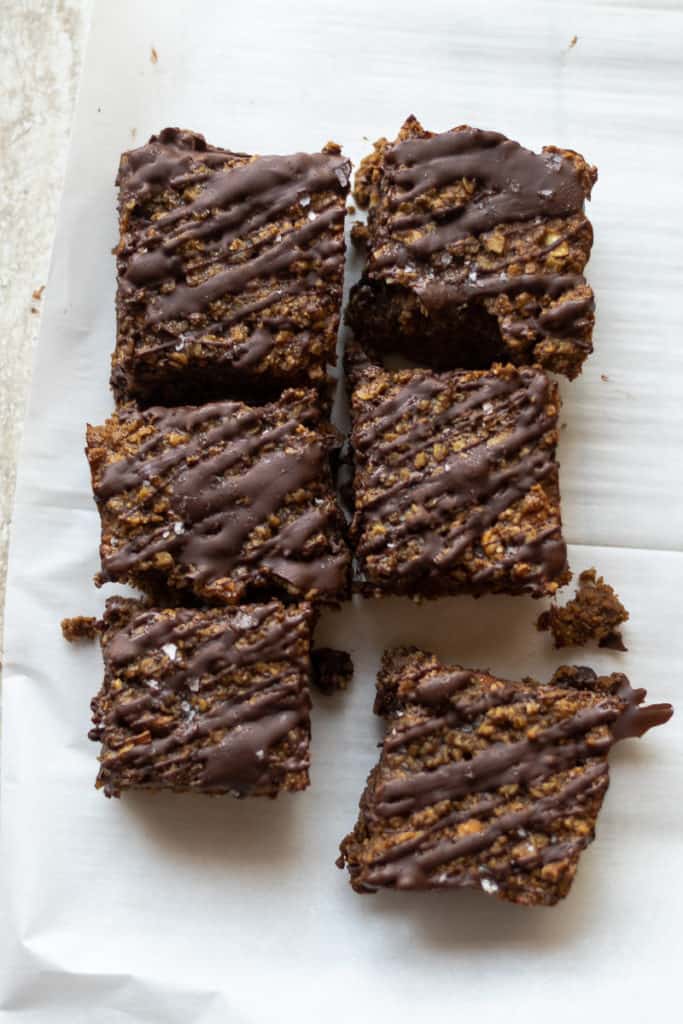 chocolate banana baked oatmeal bars cut into eight squares