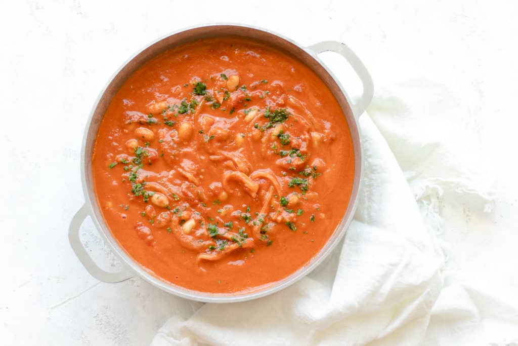 Creamy tomato soup with hearty Gigante beans and fresh herbs