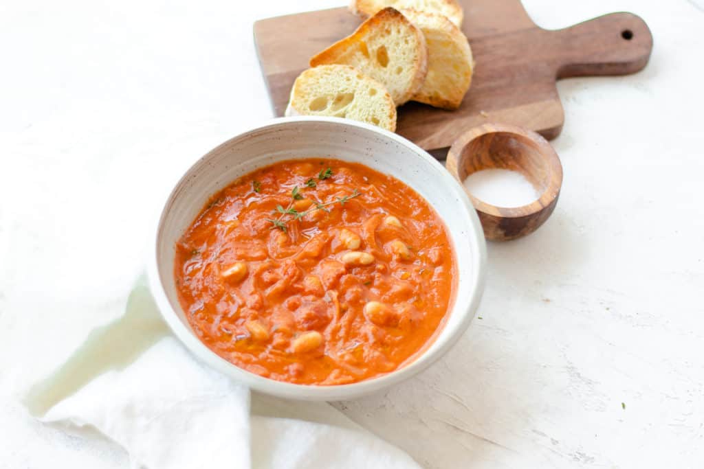 Rustic tomato soup served with a side crusty bread 