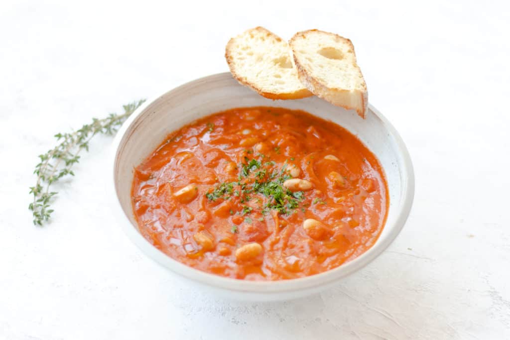 Hearty tomato soup with tender Gigante beans and aromatic garlic