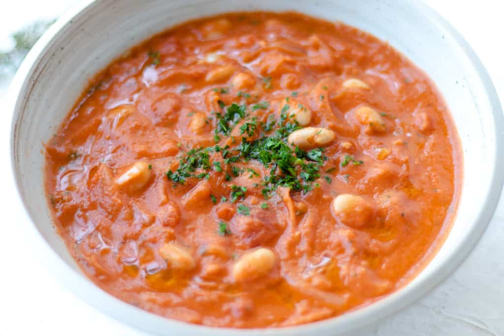 delicious tomato soup with creamy white beans and fragrant herbs