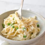creamy lemon ricotta pasta being swirled with a fork