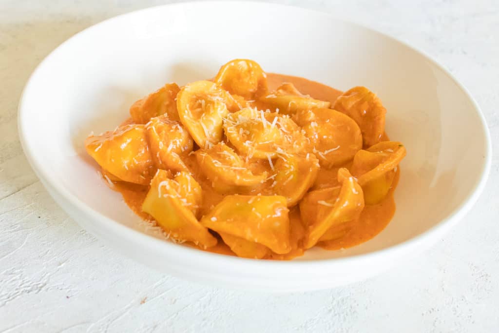 tortellini in vodka sauce with grated parmesan cheese