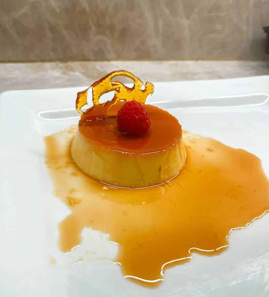 Caramel Flan topped with a Raspberry