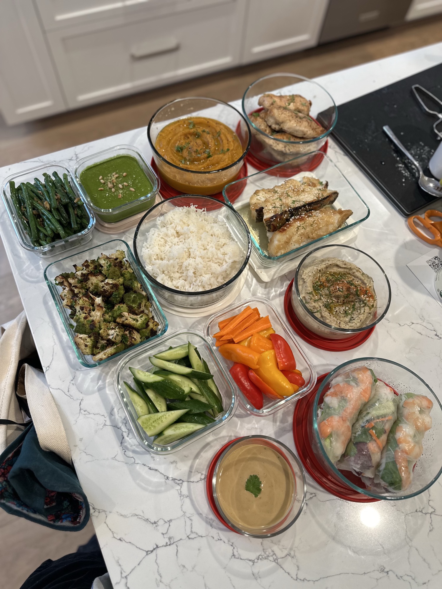 Summer rolls, roasted chicken and fish portioned into weekly containers by an Eats by Nicole chef