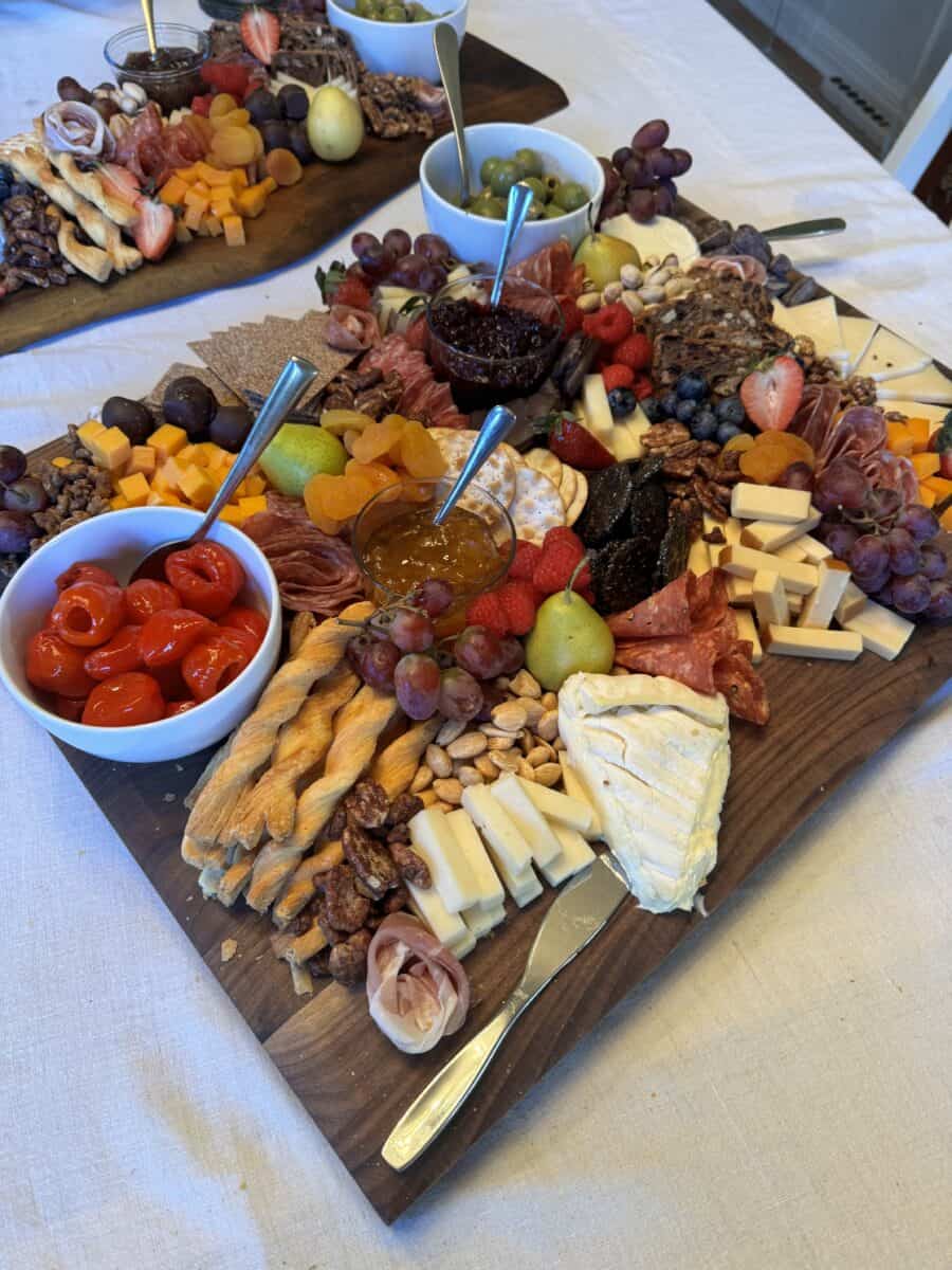 A grazing board of cheeses, charcuterie and fruit built for a private event
