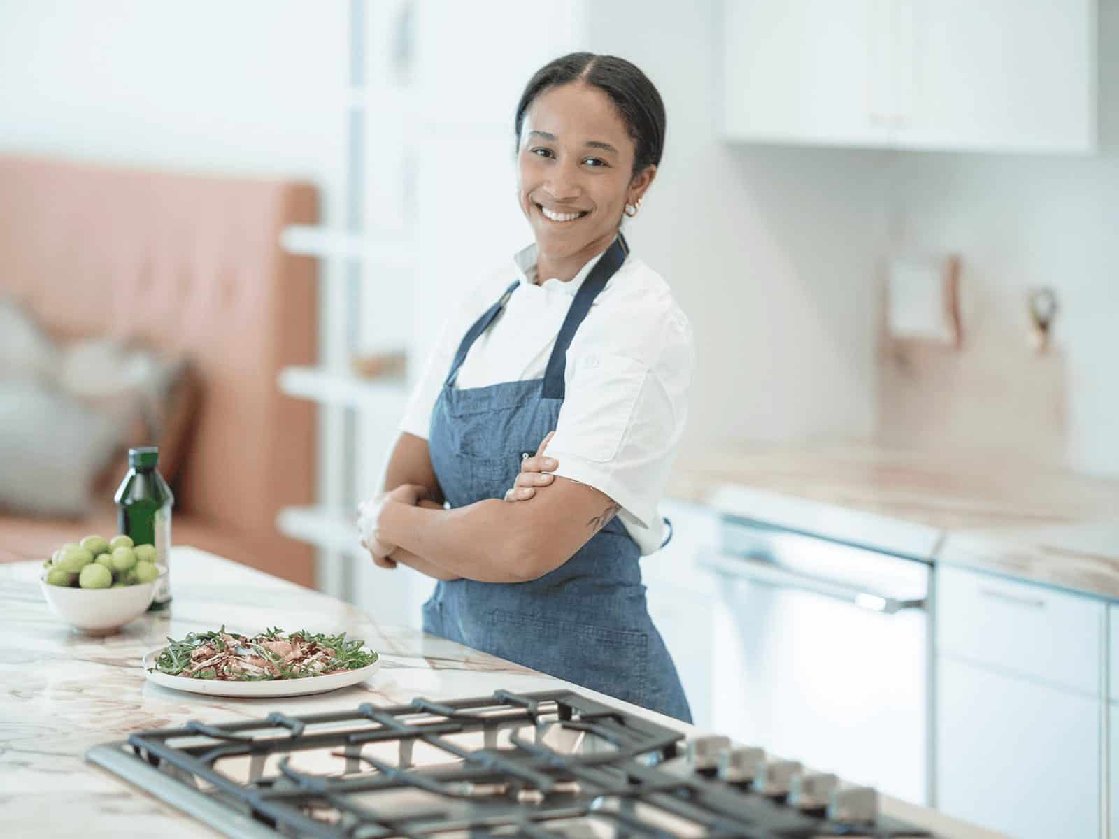 Nicole Lee, Food Network champion and founder of Eats by Nicole, in a client kitchen
