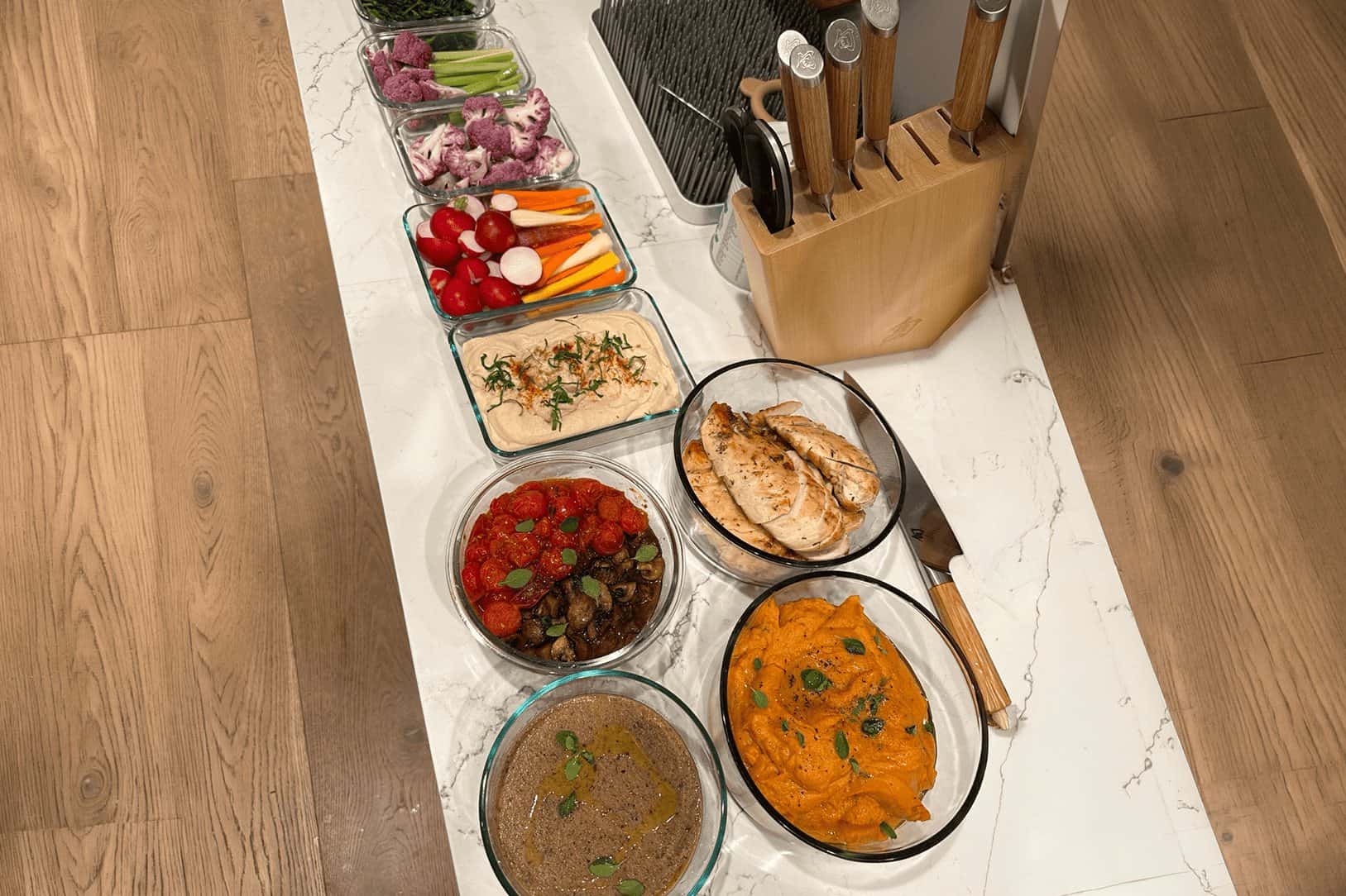 A full private chef cook day laid out across an Orange County kitchen island