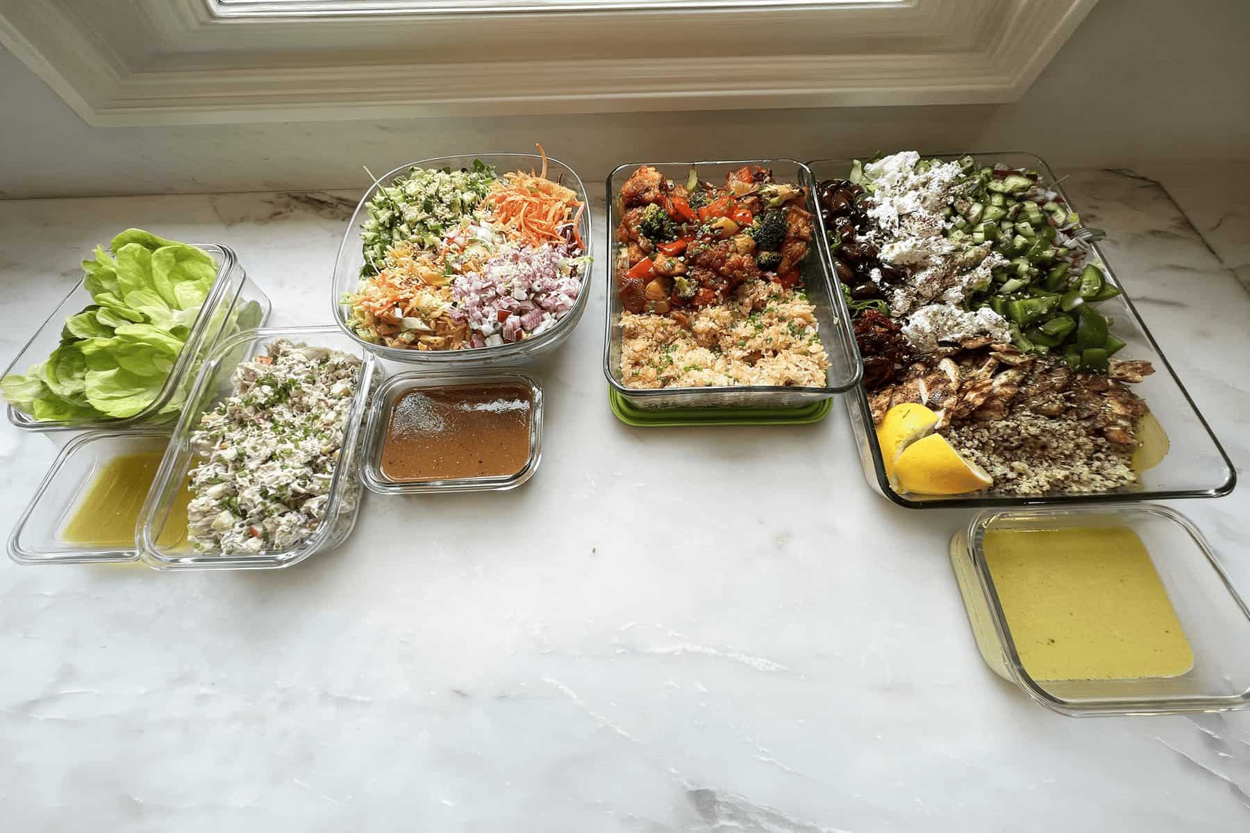 A full private chef cook day of meals, salads and sauces laid out on a New Jersey kitchen counter